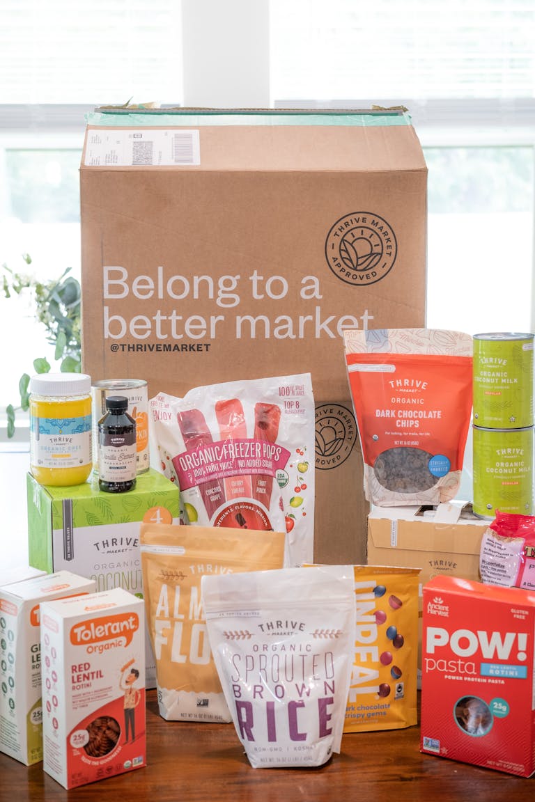 Assorted Thrive Market organic food products in packaging, indoors display.